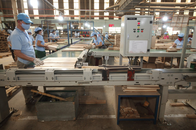 Processing wooden furniture for export at Scansia Pacific Company. Photo: Scansia Pacific.