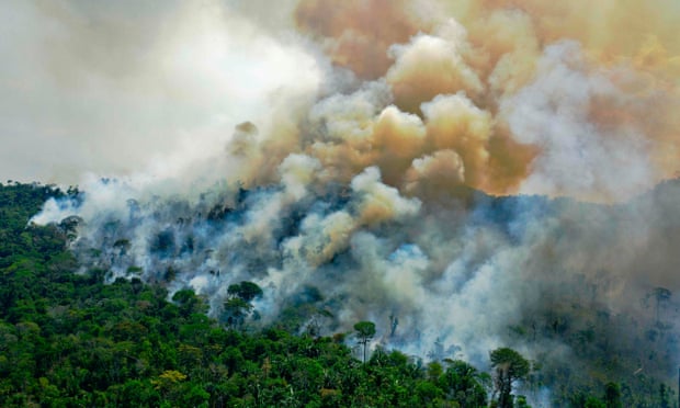 A burning area of rainforest reserve in Pará state, Brazil. Much of the Amazon is close to a tipping point at which it becomes savannah, researchers have warned. Photograph: Carl de Souza/AFP/Getty Images