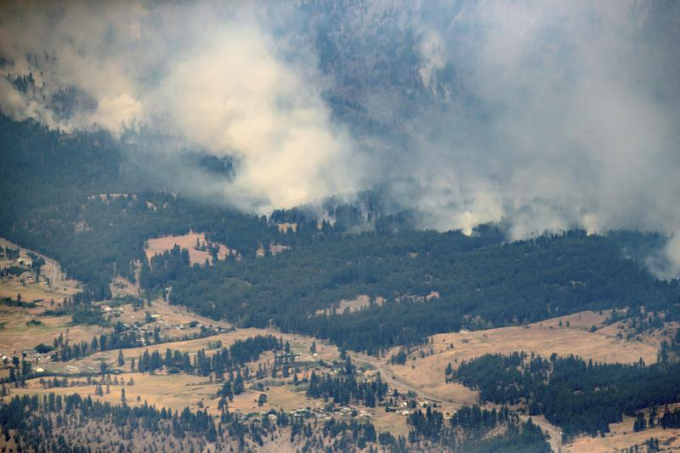 A wildfire burns in the mountains north of Lytton, British Columbia, Canada, during record high temperatures. According to a study released on Wednesday, July 7, 2021, the deadly heat wave that roasted the Pacific Northwest and western Canada 'was virtually impossible without human-caused climate change' which also added a few extra degrees to the record-smashing warmth. Photo: The Canadian Press 