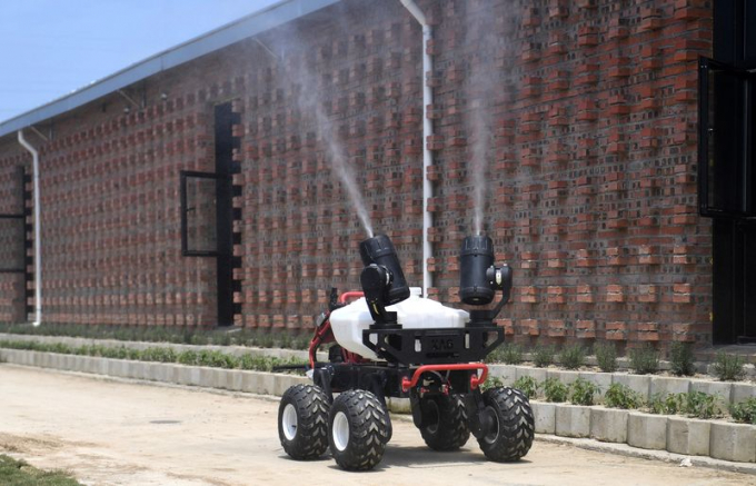 A disinfection robot works outside a pig farm in Jiaxing, in April.Photo: Getty Images