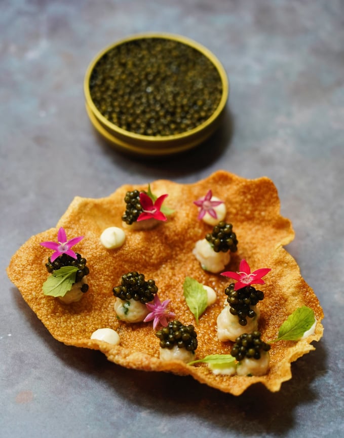 Salted & Hung's collagen chips with cured kingfish, caviar and smoked cream. Photo: Salted & Hung