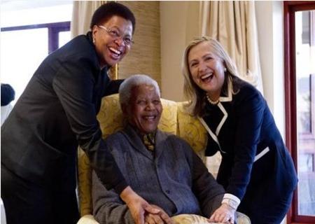 Secretary of State Hillary Rodham Clinton meets with former South Africa President Nelson Mandela, 94, and his wife Graca Machel at his home in Qunu, South Africa, Monday, Aug. 6, 2012.