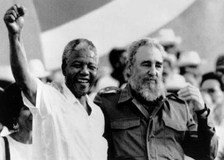 Cuban President Fidel Castro, right, and African leader Nelson Mandela gesture during the celebration of the "Day of the Revolution" in Matanzas Saturday, July 27, 1991. Cubans celebrate 38th anniversary of the revolution.
