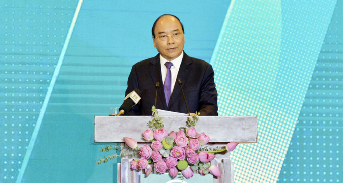 Thủ tướng Chính phủ Nguyễn Xuân Phúc tại hội nghị ''Hà Nội 2020 - Hợp tác đầu tư và phát triển'' sáng 27/6. Ảnh: hanoimoi.