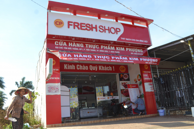 Đồng loạt 45 cửa hàng C.P Bình Phước bán thịt heo bình ổn giá. Ảnh: Trần Trung.