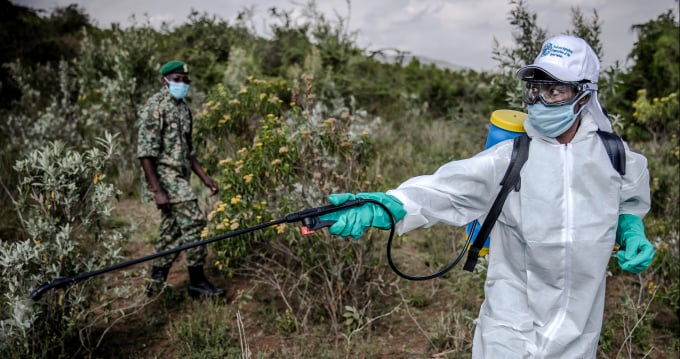 Sergeant Brian Odhiambo imparts a lesson on how to use spraying tools to National Youth Service officers during a training on desert locust control in Gilgil, Kenya.