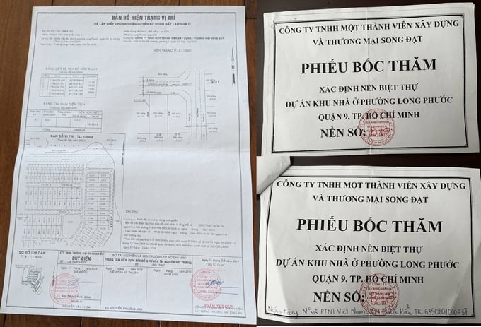 ban-do-quy-hoach-1500-va-phieu-boc-tham-dat-nen-180932_550.jpg Phiếu bốc thăm nhận nền năm 2010 và bản đồ quy hoạch 1/500 dự án. Ảnh chụp văn bản.