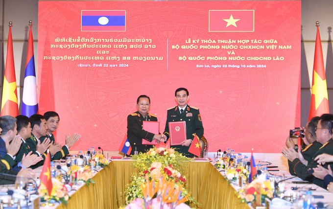 img_4317-211143_935.jpeg Lễ ký thoả thuận hợp tác giữa Bộ Quốc phòng Việt Nam và Bộ Quốc phòng Lào. Ảnh: Quốc Tuấn.