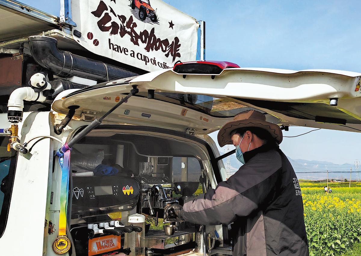 A mobile cafe runner serves cafe in Mianxian county, Shaanxi province, on March 19. 
