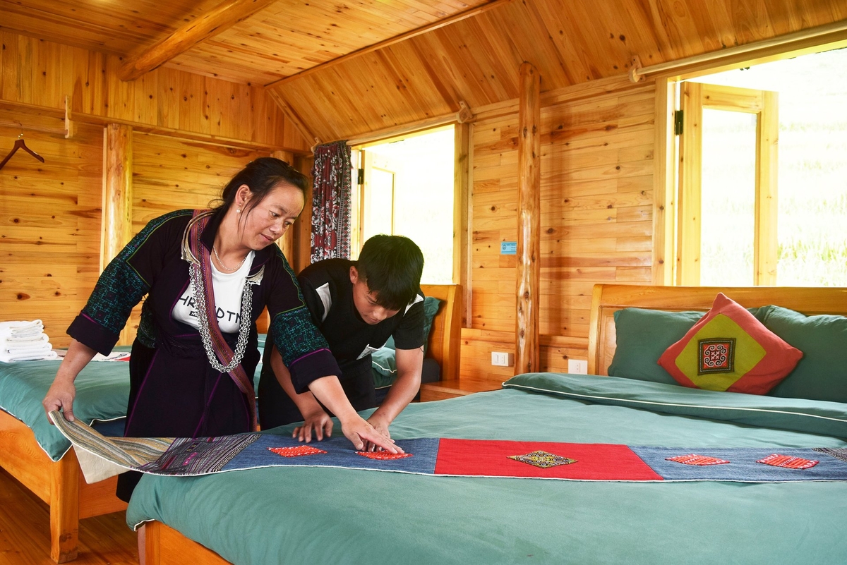 Mô hình kinh doanh homestay của gia định chị Sùng Thị Mú tại Mường Hoa, thị xã Sa Pa. Ảnh: Bích Hợp. Mô hình kinh doanh homestay của gia định chị Sùng Thị Mú tại Mường Hoa, thị xã Sa Pa. Ảnh: Bích Hợp.