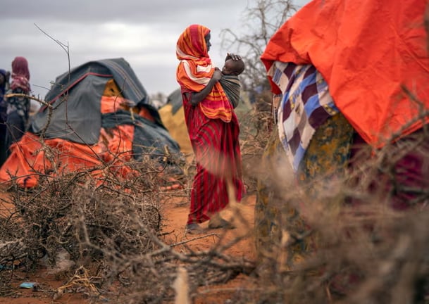 A woman and child at a camp for displaced people near Dollow, Somalia. A quarter of the country’s population are edging towards starvation. Photograph: Jérôme Delay.