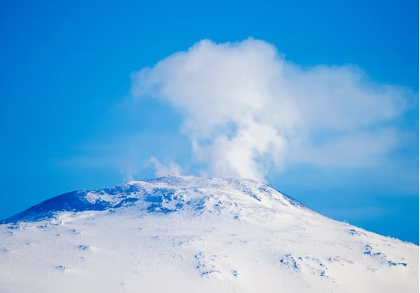 Mount Erebus in Antarctica. The biggest risk of reawakening volcanos is in west Antarctica where at least 100 lie under the ice, say researchers.Photograph: Jason Edwards/Alamy.