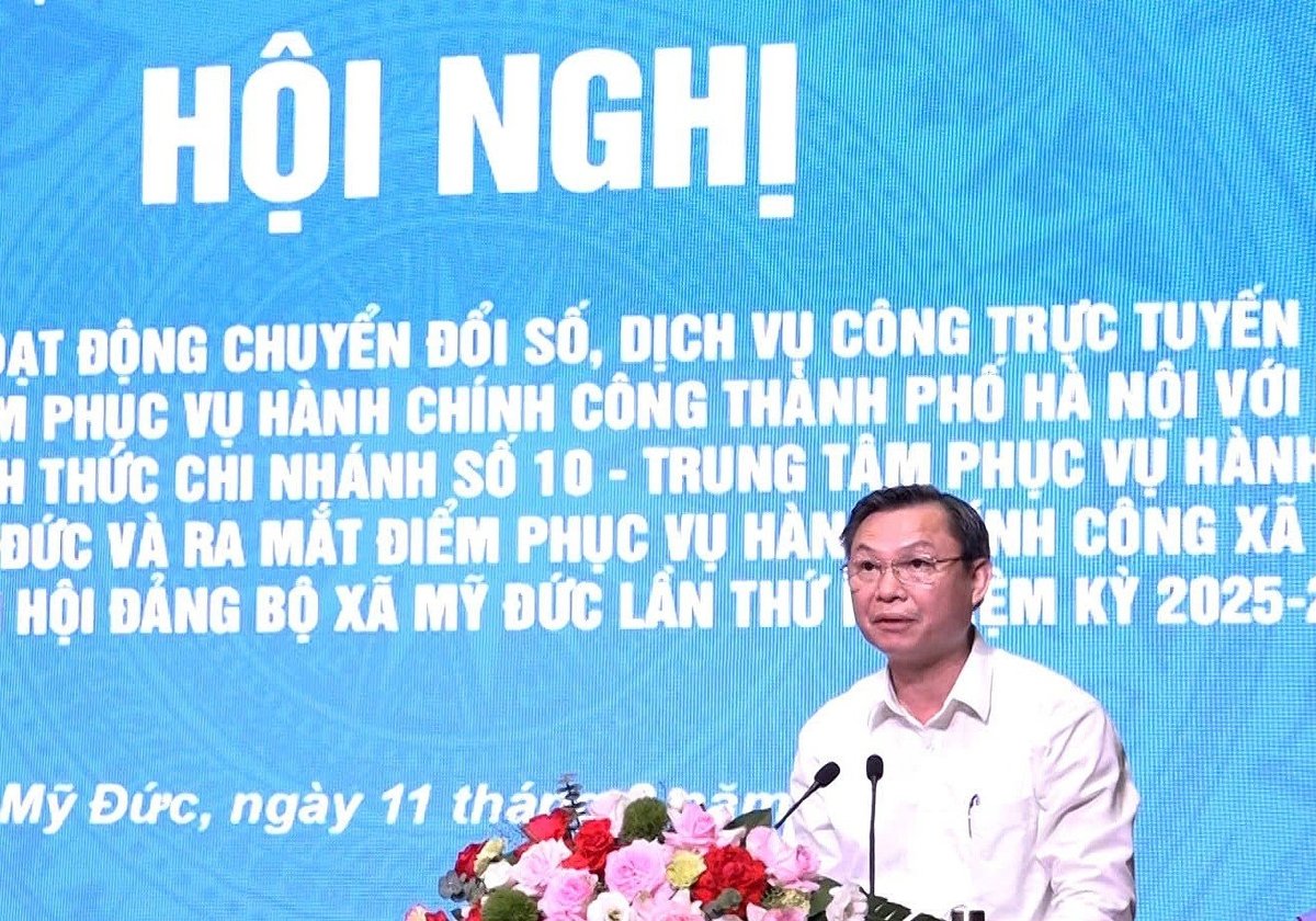 Bí thư Đảng ủy, Chủ tịch UBND xã Mỹ Đức Đặng Văn Cảnh phát biểu tại Hội nghị ký kết hợp tác giữa Trung tâm dịch vụ Hành chính công TP Hà Nội và xã Mỹ Đức. Ảnh: Trung tâm dịch vụ HCC TP Hà Nội.