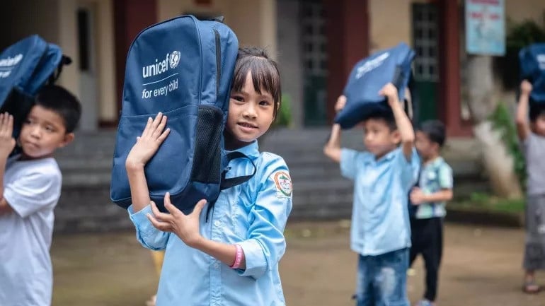 hildren at Phuc Khanh 1 Primary and Secondary School in Lao Cai Province receive school bags and essential school supplies through UNICEF's support. Photo: UNICEF.