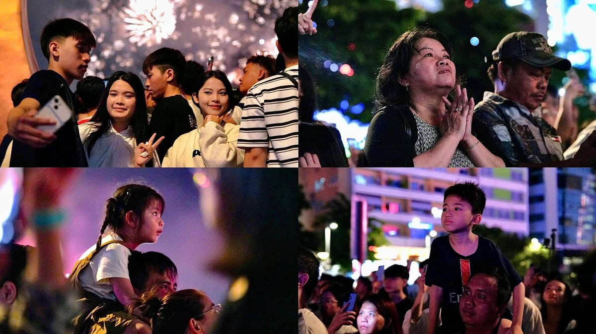 Người dân chăm chú theo dõi màn pháo hoa tại khu vực trung tâm. Trẻ em được người thân bế lên cao để quan sát, trong khi nhiều bạn trẻ tranh thủ ghi lại khoảnh khắc bằng điện thoại. 