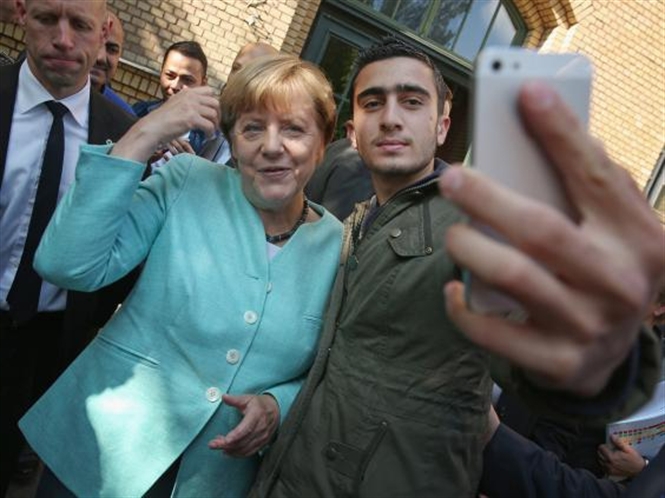 15-38-31_merkel-migrnt