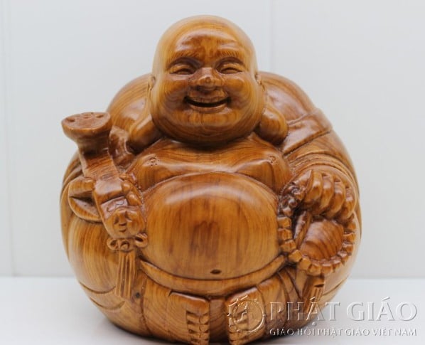 Hình tượng Phật Di Lặc được khắc chạm trổ trên gỗ tay cầm chuổi hạt