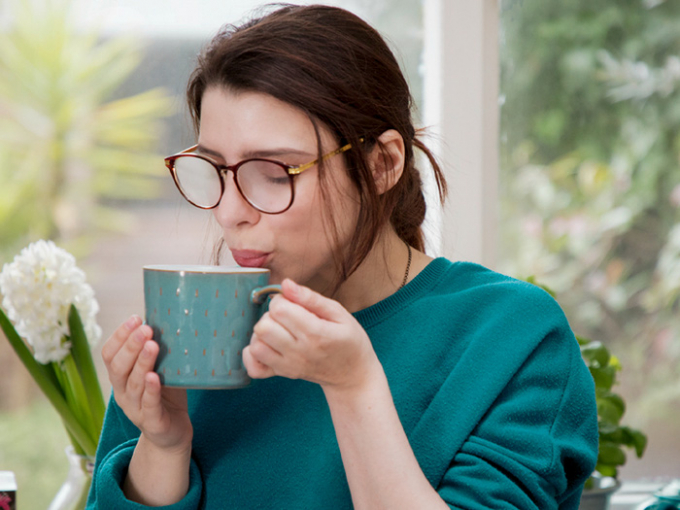 woman-is-blowing-into-hot-drink-732x549-thumbnail-1602667627968578743856