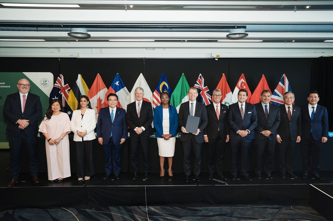 Các đại biểu tại lễ ký kết gia nhập Hiệp định Đối tác Toàn diện và Tiến bộ xuyên Thái Bình Dương (CPTPP). Ảnh: Bộ Ngoại giao Anh