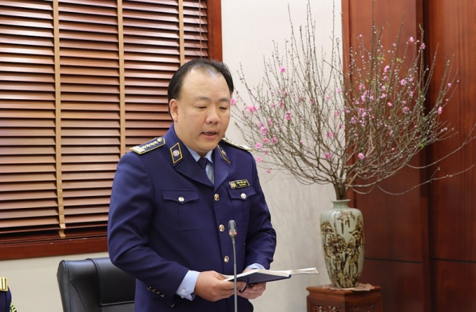 Ông Trần Hữu Linh - Tổng Cục trưởng Tổng cục QLTT báo cáo kết quả hoạt động trong năm 2021.