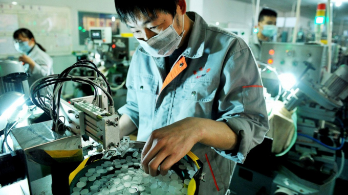 Các nhà máy tại Trung Quốc đang bắt đầu hoạt động trở lại. Ảnh: AP.