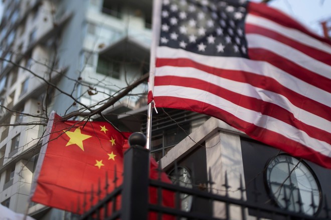 Trung Quốc và Mỹ thống nhất dỡ bỏ các lệnh áp thuế lên hàng hóa hai nước theo từng giai đoạn. Ảnh: AFP.