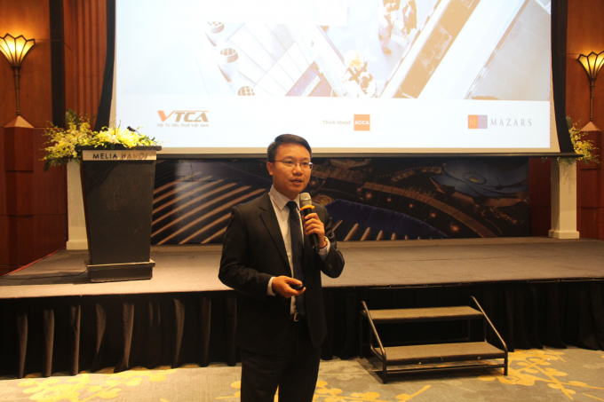 Ông Nguyễn Hải Minh - Phó Tổng Giám đốc Dịch vụ Thuế và Tư vấn doanh nghiệp - Mazars Việt Nam trình bày tham luận