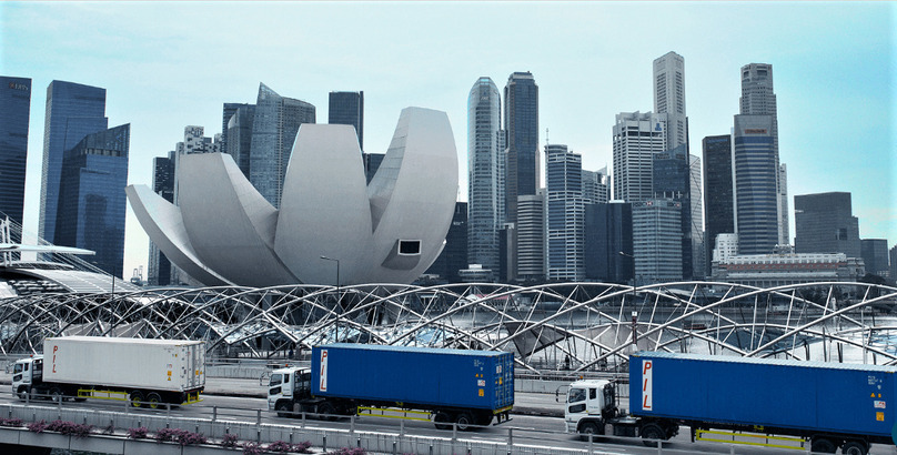 PIL containers transported by trucks in Singapore. Photo courtesy of PIL.