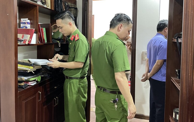 Police inspect the house of one of the four defendants. Photo courtesy of Lao Cai police.