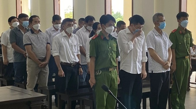 Defendant Nguyen Minh Chuyen (first row, second from right) and his accomplices in court on June 30, 2022. Photo courtesy of Vietnam News Agency.