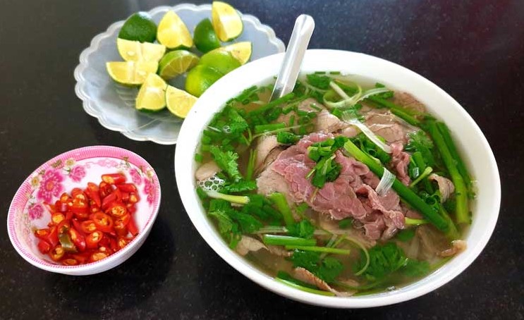 Traditional pho comprises of rice noodles, bone broth, thinly sliced beef or chicken, and scallion or herbs. Photo courtesy of Hotel84.com