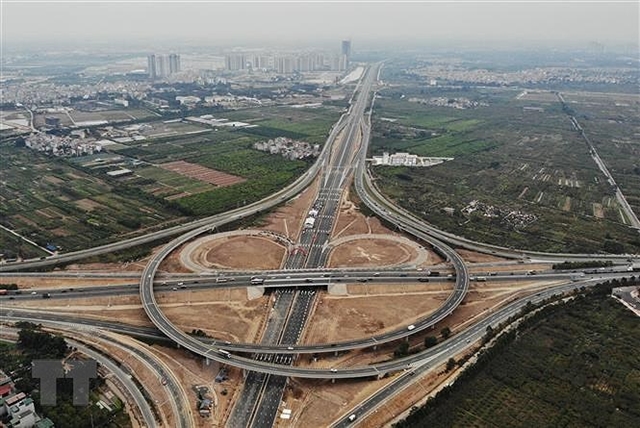 An intersection of the Hai Phong-Hanoi Expressway. A large trunk of Vietnam's government debt funds infrastructure development.