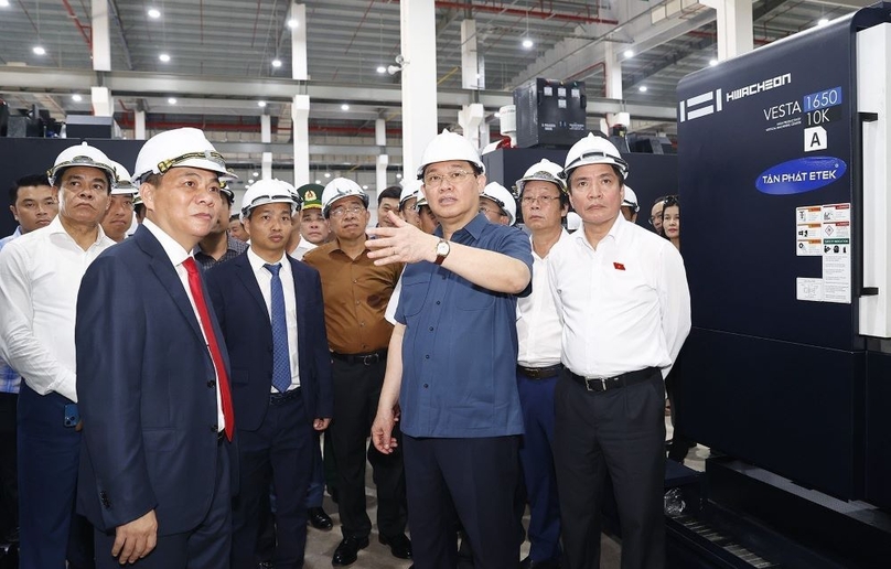 NA Chairman Vuong Dinh Hue visits VinES Energy Solution JSC in Ha Tinh province on August 31, 2022. Photo courtesy of Vietnam News Agency.
