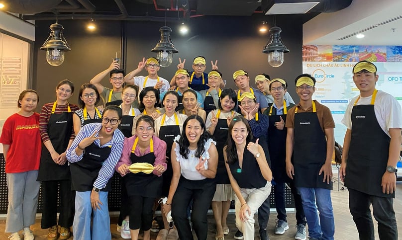 CloudEats CEO Kimberly Yao (front, in black) poses for a group photo with her Vietnam staff members in HCMC, southern Vietnam.