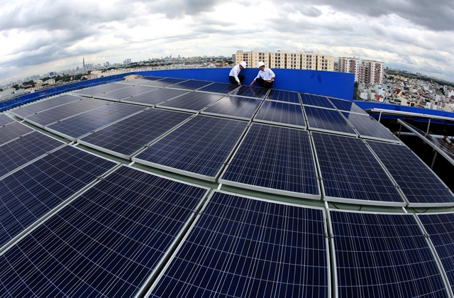 Rooftop solar panels are installed on a building in HCMC. Photo courtesy of Vietnam News Agency.
