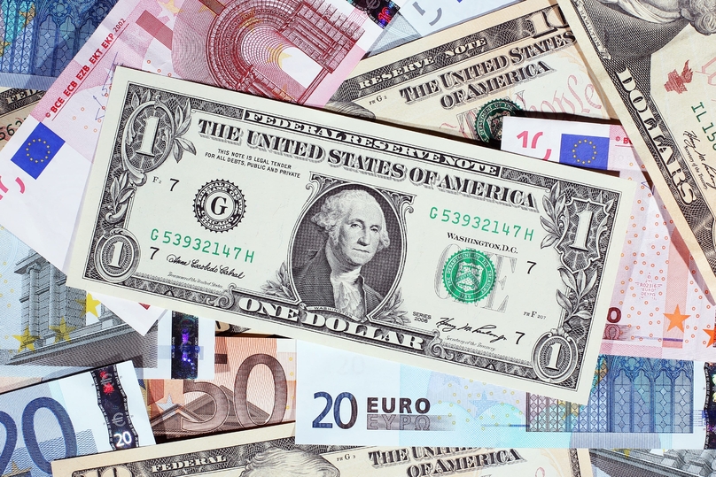 A U.S. dollar note seen with other currencies. Photo courtesy of CNBC.