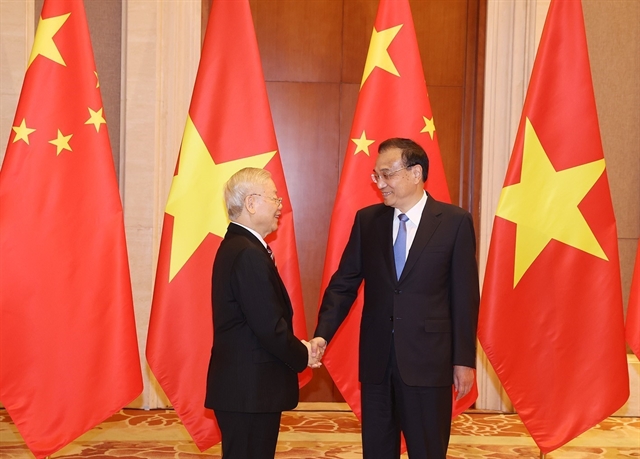 Vietnamese Party chief Nguyen Phu Trong (L) meets with Chinese Premier Li Keqiang in Beijing on November 1, 2022 as part of his official visit to China