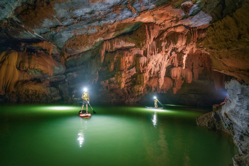 Hung Thoong's Tron Cave has a blue lake and beautiful stalactites. Photo courtesy of Vietnamnet newspaper.
