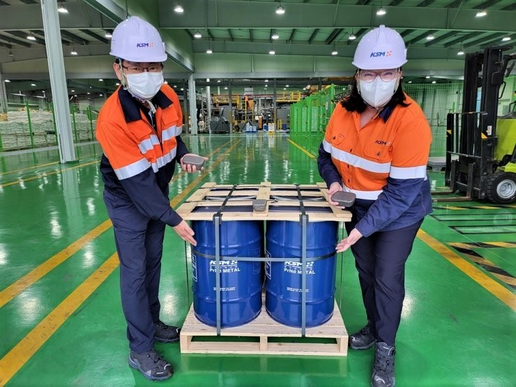 ASM CEO Rowena Smith (R) and KSM Metals CEO Cho Sung-lea stand next to metal products used for rare earth element permanent magnet manufacturing at KSM Metals plant in Ochang, North Chungcheong, South Korea. Photo courtesy of ASM.