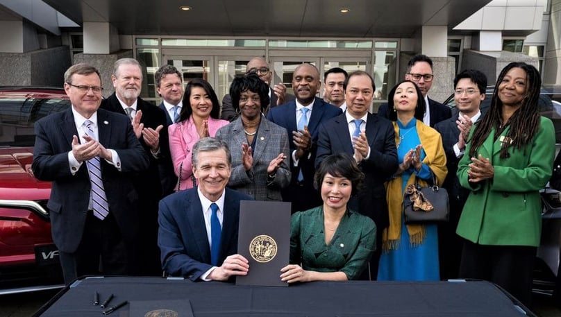  VinFast Global CEO Le Thi Thu Thuy (seated, R) and North Carolina Governor Roy Cooper (seated, L) in the MoU signing ceremony for VinFast’s North Carolina factory project in March 2022. Photo courtesy of VinFast.