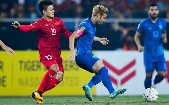 Thailand's Theerathon Bunmathan (mid) challenged by Vietnam's Nguyen Quang Hai at Thammasat Stadium in AFF Cup 2022 second-leg final on January 16, 2023. Photo courtesy of Asean Football Federation.