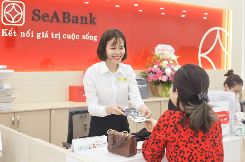 A customer (middle) served at a SeABank office in Vietnam. Photo courtesy of the bank.