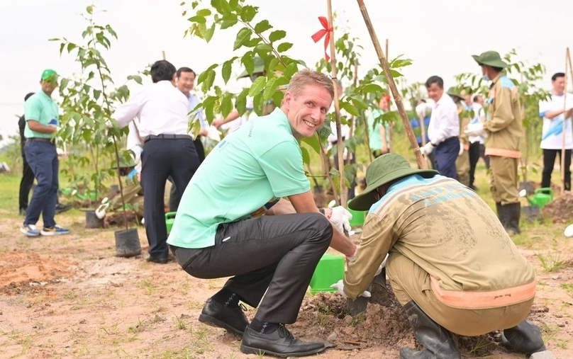 Lego Manufacturing Vietnam Co. general manager Preben Elnef plants a tree in a campaign designed to compensate for vegetation removed during the construction of the group's factory in Binh Duong province, southern Vietnam.