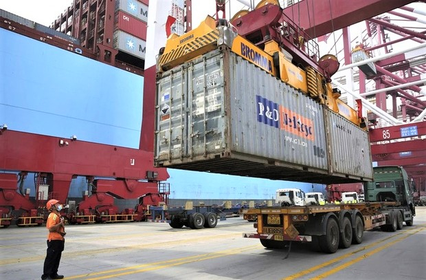 A container truck at a port in Vietnam. The UK’s accession to the CPTPP will help increase trade. Photo courtesy of Vietnam Television.