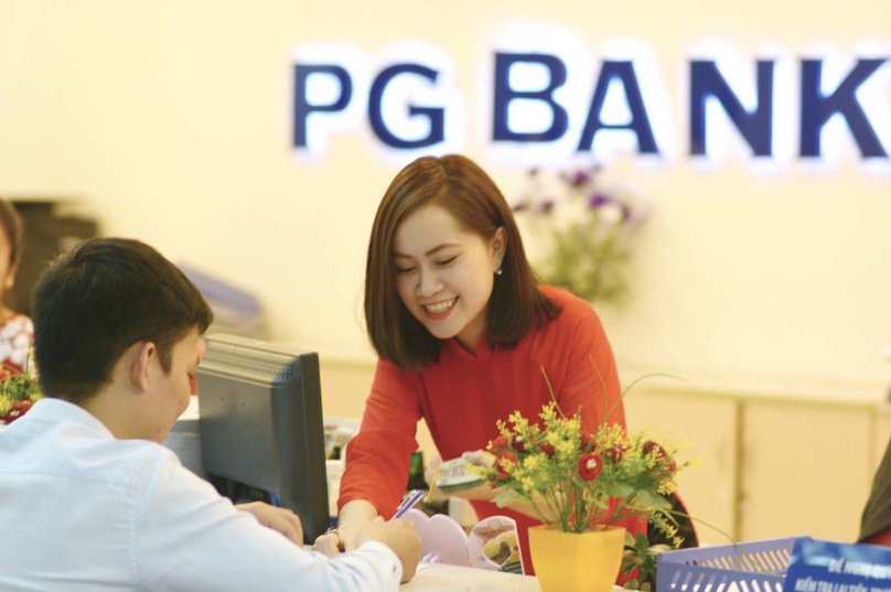 A customer makes transactions at PGBank. Photo courtesy of the bank.