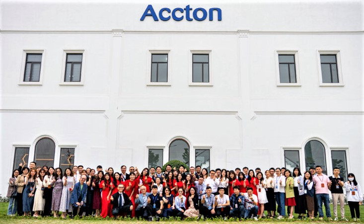 Leaders and staff members of Accton Vietnam pose for pictures in front of the Accton Vietnam plant in Vinh Phuc province near Hanoi. Photo courtesy of the firm.