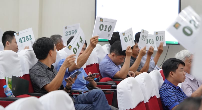 Shareholders show approval during a vote at Loc Troi Group’s AGM on April 14, 2023. Photo courtesy of Loc Troi.