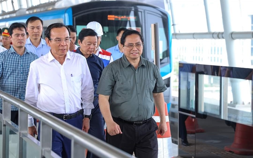Prime Minister Pham Minh Chinh (first, right) checks over the operation of a trial train on HCMC's first metro line on April 15, 2023. Photo courtesy of the government portal.