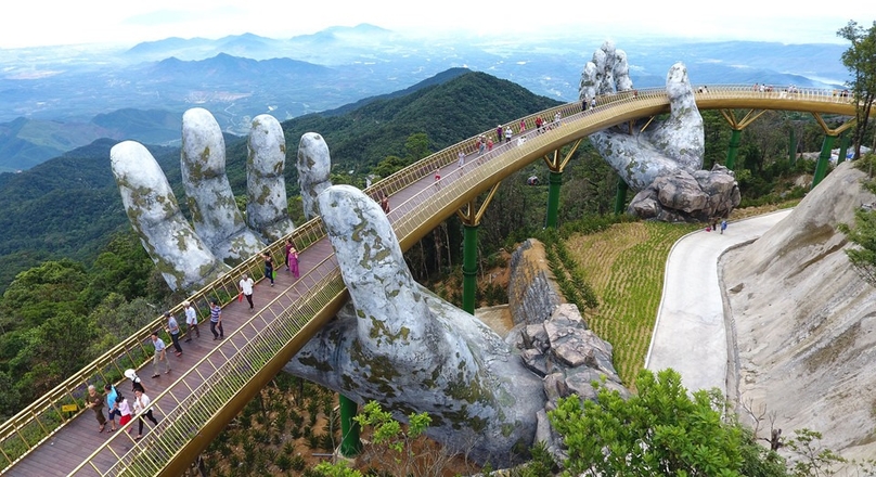 The Golden Bridge shimmers against the Ba Na Hills, supported by a pair of giant hands. Photo courtesy of Arch Daily.