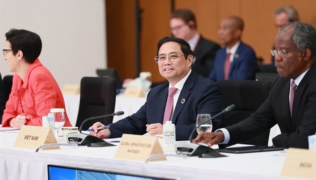 Prime Minister Pham Minh Chinh addresses the 'Working to address multiple crises' session of the G7 expanded Summit in Hiroshima, Japan. Photo courtesy of Vietnam News Agency.